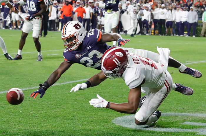 Nov 27, 2021; Auburn, Alabama, USA; Auburn Tigers cornerback Roger McCreary (23) breaks up a pass intended for Alabama Crimson Tide wide receiver Traeshon Holden (11) during the third quarter at Jordan-Hare Stadium. Mandatory Credit: John Reed-USA TODAY Sports